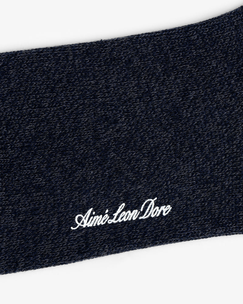 Close-up of Marled Quarter Sock knit with "Aime Leon Dore" embroidered in white cursive.