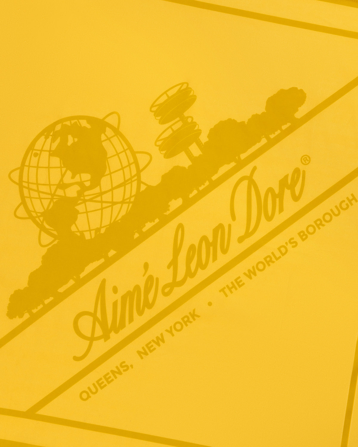 Sun Faded Unisphere Bandana: yellow graphic with Aimé Leon Dore, globe, trees, and Queens, New York text.