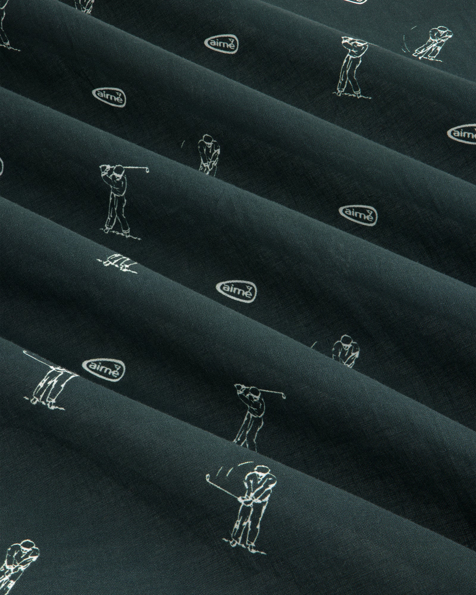 The ALD Golf Swing Bandana features dark fabric with white golfer sketches and airmx logos arranged diagonally.