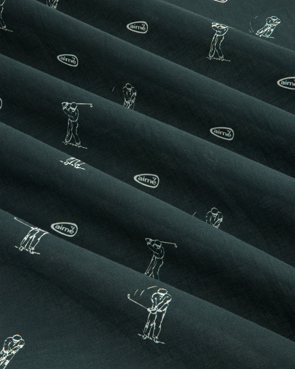 The ALD Golf Swing Bandana features dark fabric with white golfer sketches and airmx logos arranged diagonally.