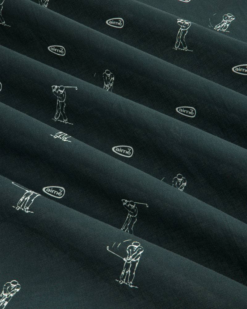 The ALD Golf Swing Bandana features dark fabric with white golfer sketches and airmx logos arranged diagonally.
