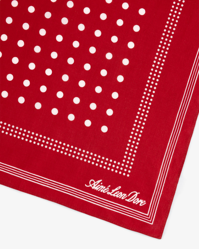 Polka Dot Bandana in red with white dots, stripes, and cursive Aimé Leon Dore text in the corner.