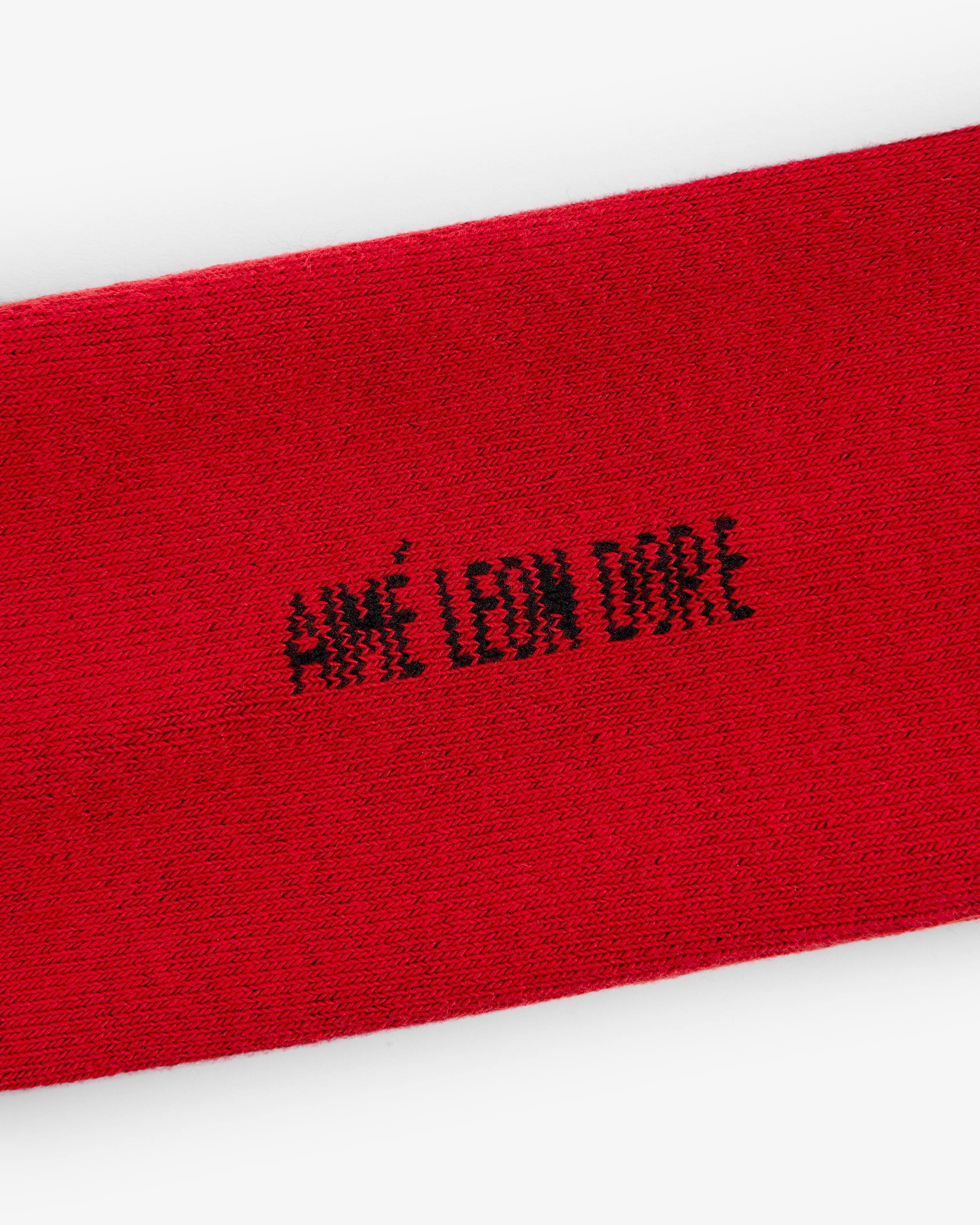 Red Crew Sock 3-Pack with AIMÉ LEON DORE in black pixelated text at the center.