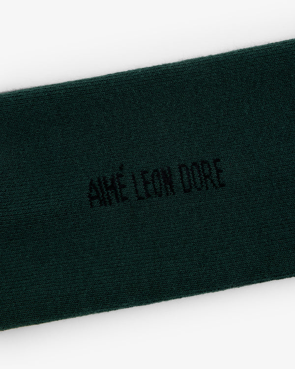 Dark green Crew Sock 3-Pack with AIMÉ LEON DORE embroidered in black at the center.