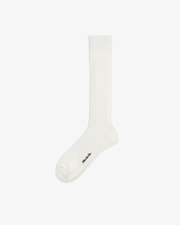 A white Dress Sock with a small black logo near the toe, shown on a plain white background.