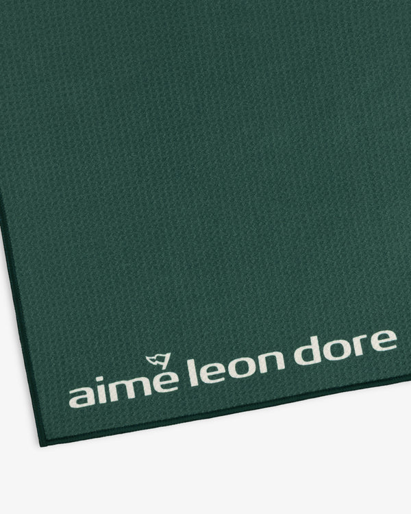 Dark green ALD Golf Caddy Towel with small white logo in the bottom right corner and textured finish.