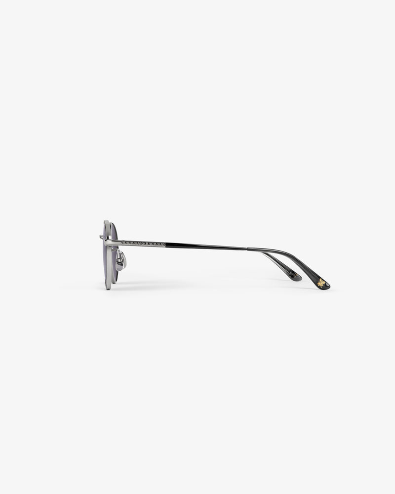 Side view of Giórgios Sunglasses in black metal with grey lenses and thin arms, on a plain white background.
