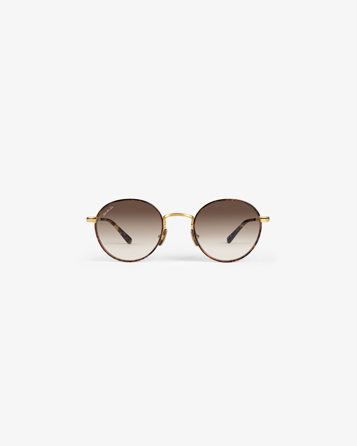 Giórgios Sunglasses: round tortoiseshell frames, brown gradient lenses, gold bridge on a white background.