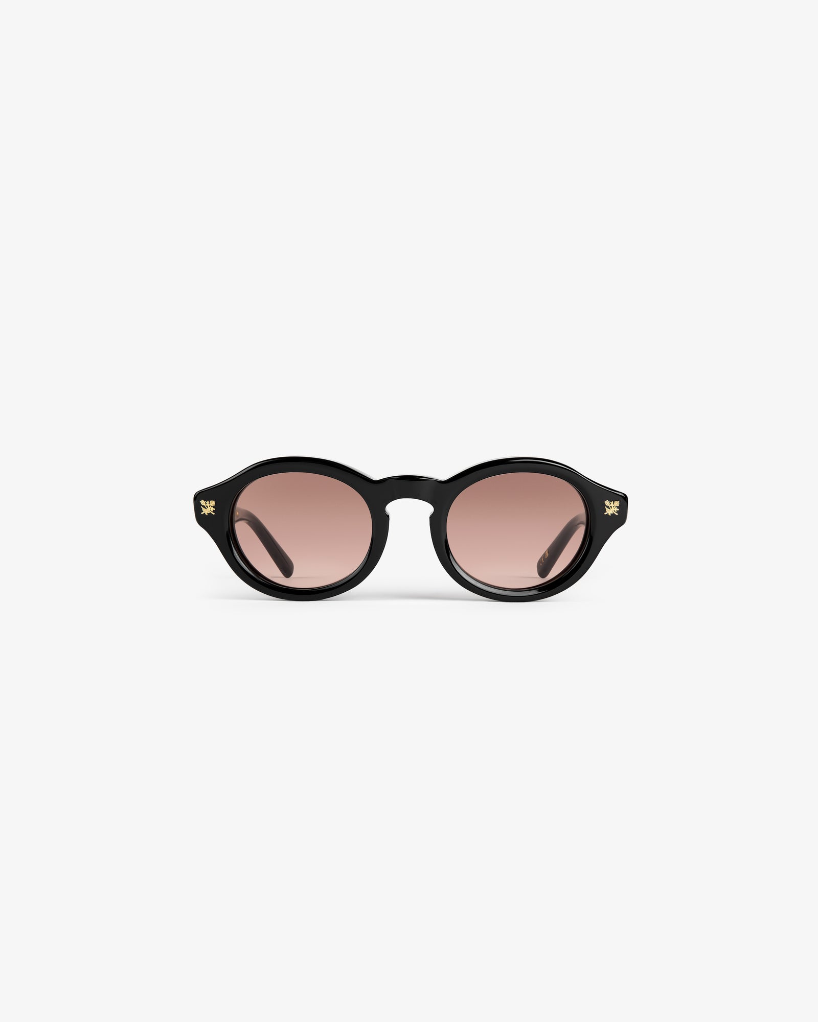 Onásis Sunglasses: round black frames with pink lenses, displayed front-facing on a plain white background.