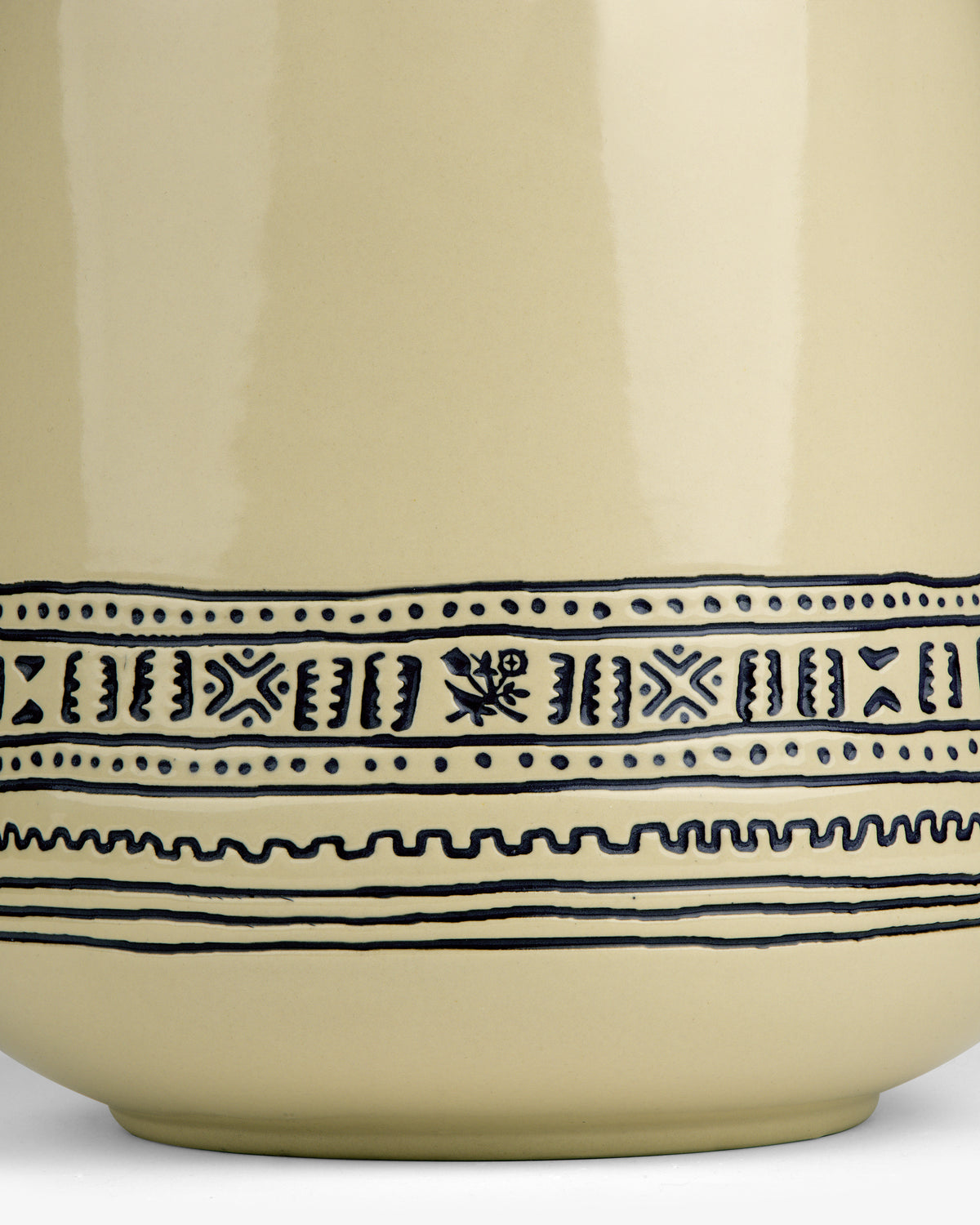 Close-up of a Textile Patterned Treat Jar with blue geometric and floral lines near the base.
