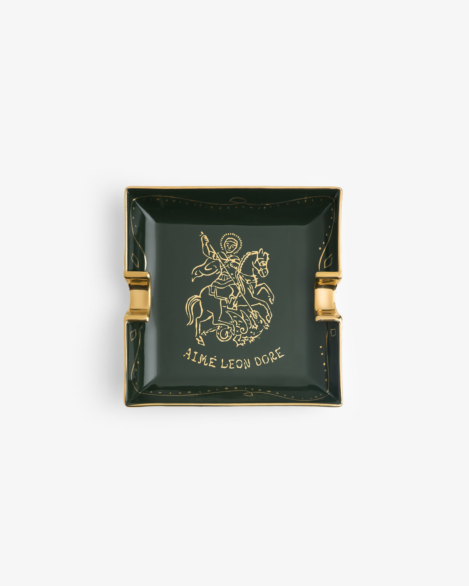 Saint George Ashtray: dark green square with gold trim, rider illustration, and AIME LEON DORE below.