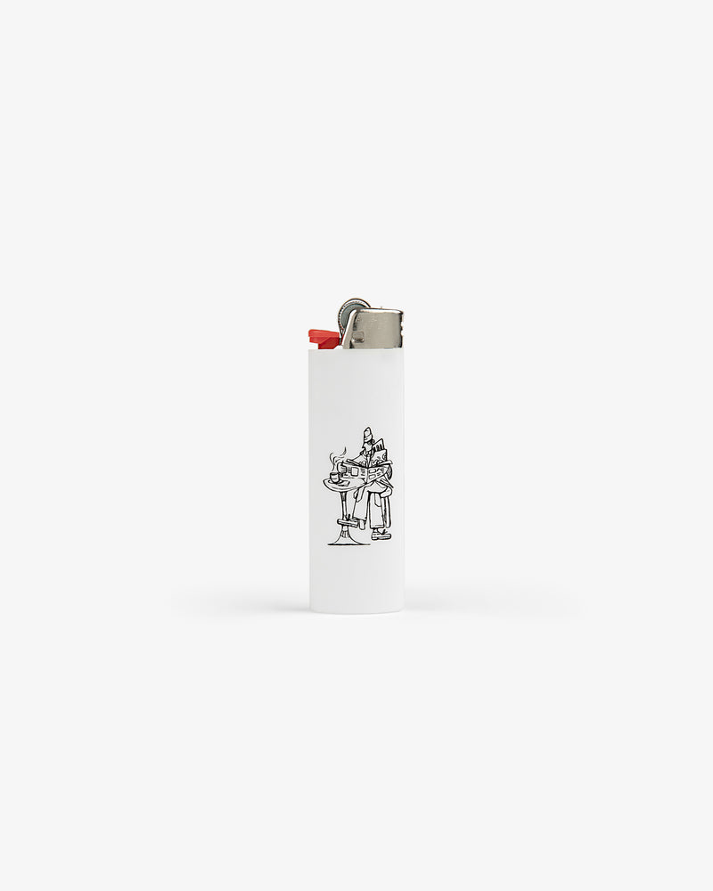 Caricature Lighter: white with a small black line drawing of two characters at a café table on the front.