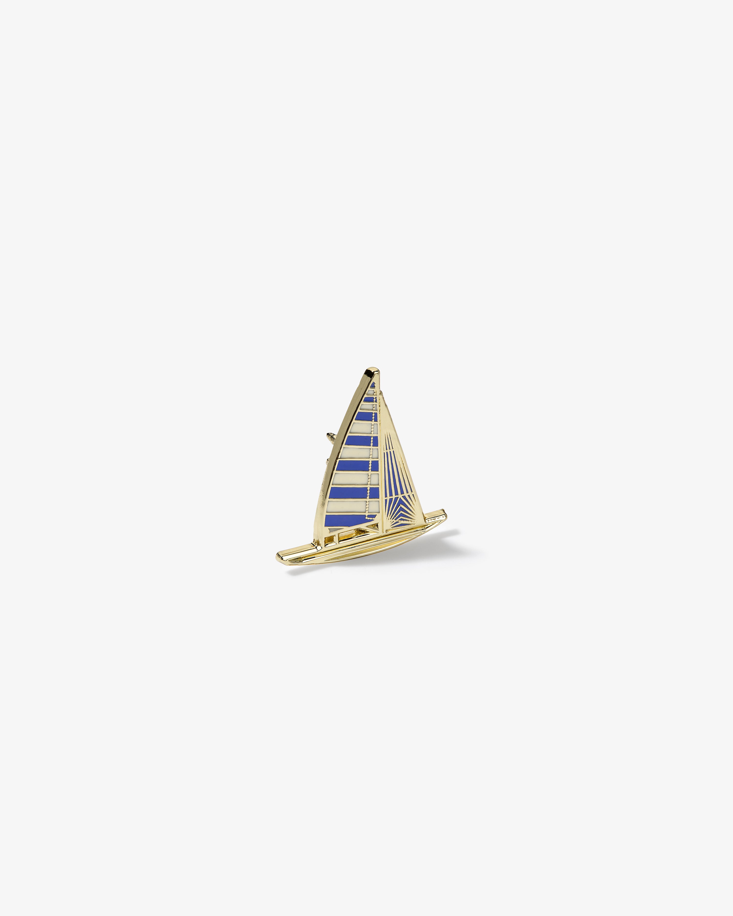 Gold and blue striped Graphic Pin in the shape of a sailboat on a plain white background.