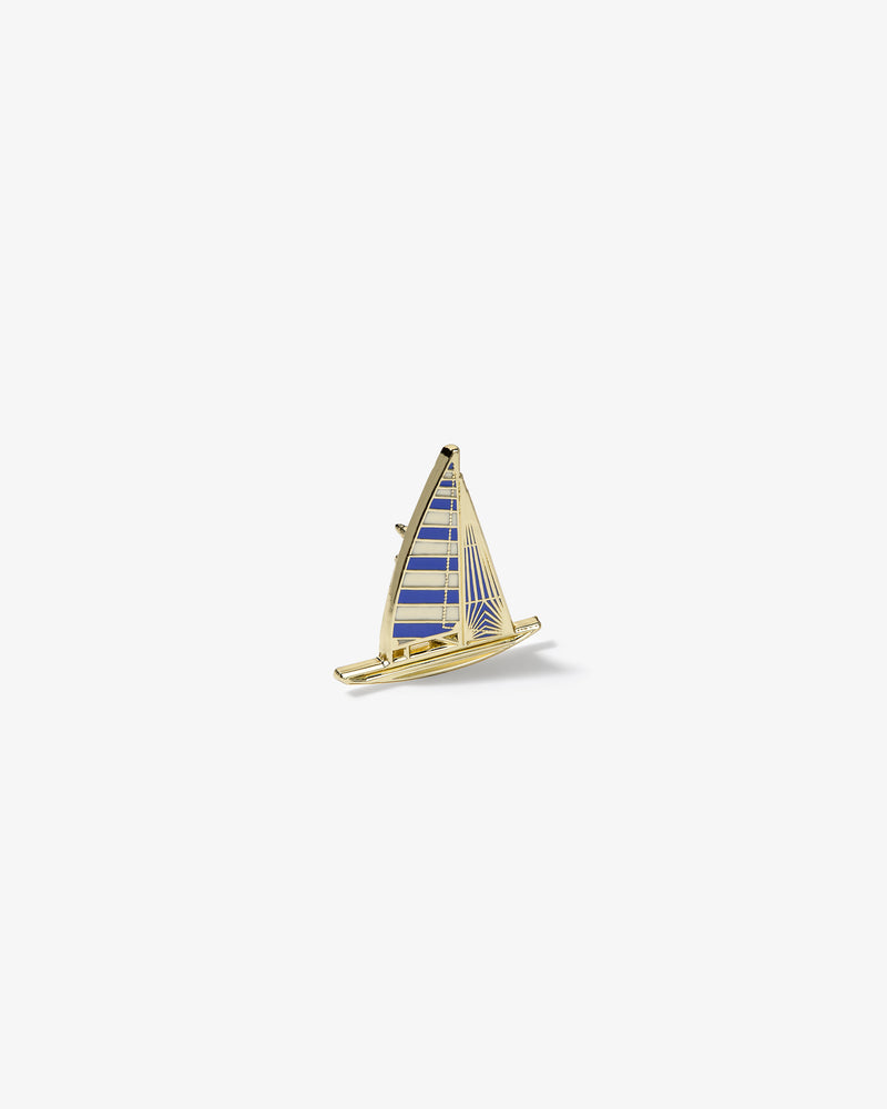 Gold and blue striped Graphic Pin in the shape of a sailboat on a plain white background.