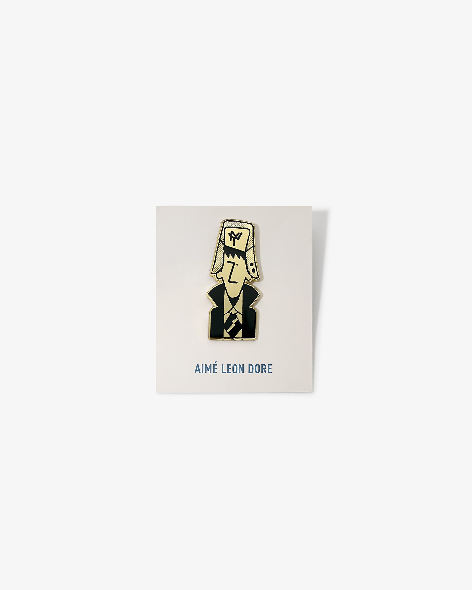 Graphic Pin featuring a cartoon person in a suit and hat, displayed on AIMÉ LEON DORE branded card.
