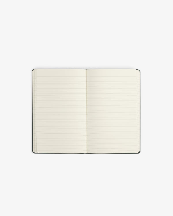 Crest Sketchbook—an open, lined notebook with blank pages on a white background.