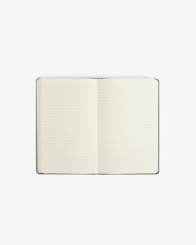Crest Sketchbook—an open, lined notebook with blank pages on a white background.