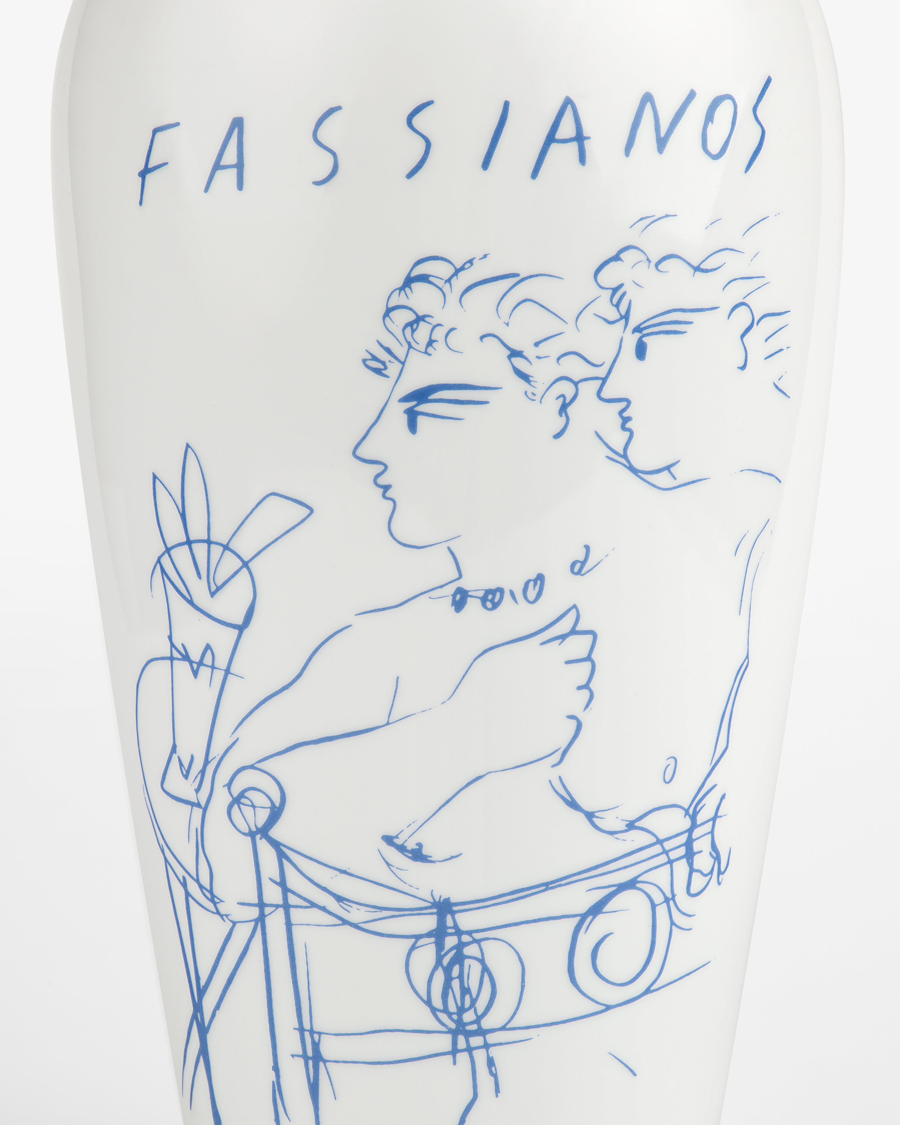 The Fassianos "Rendez-Vouz" Vase is white with blue line art of two figures and "FASSIANOS" at the top.