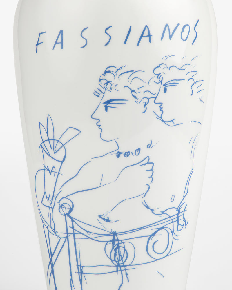 The Fassianos "Rendez-Vouz" Vase is white with blue line art of two figures and "FASSIANOS" at the top.