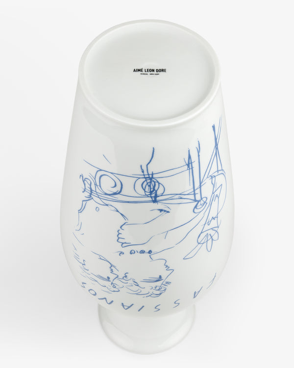 Fassianos "Rendez - Vouz" Vase: white ceramic with blue line art, “AIME LEON DORE” on the base, shown upside down.