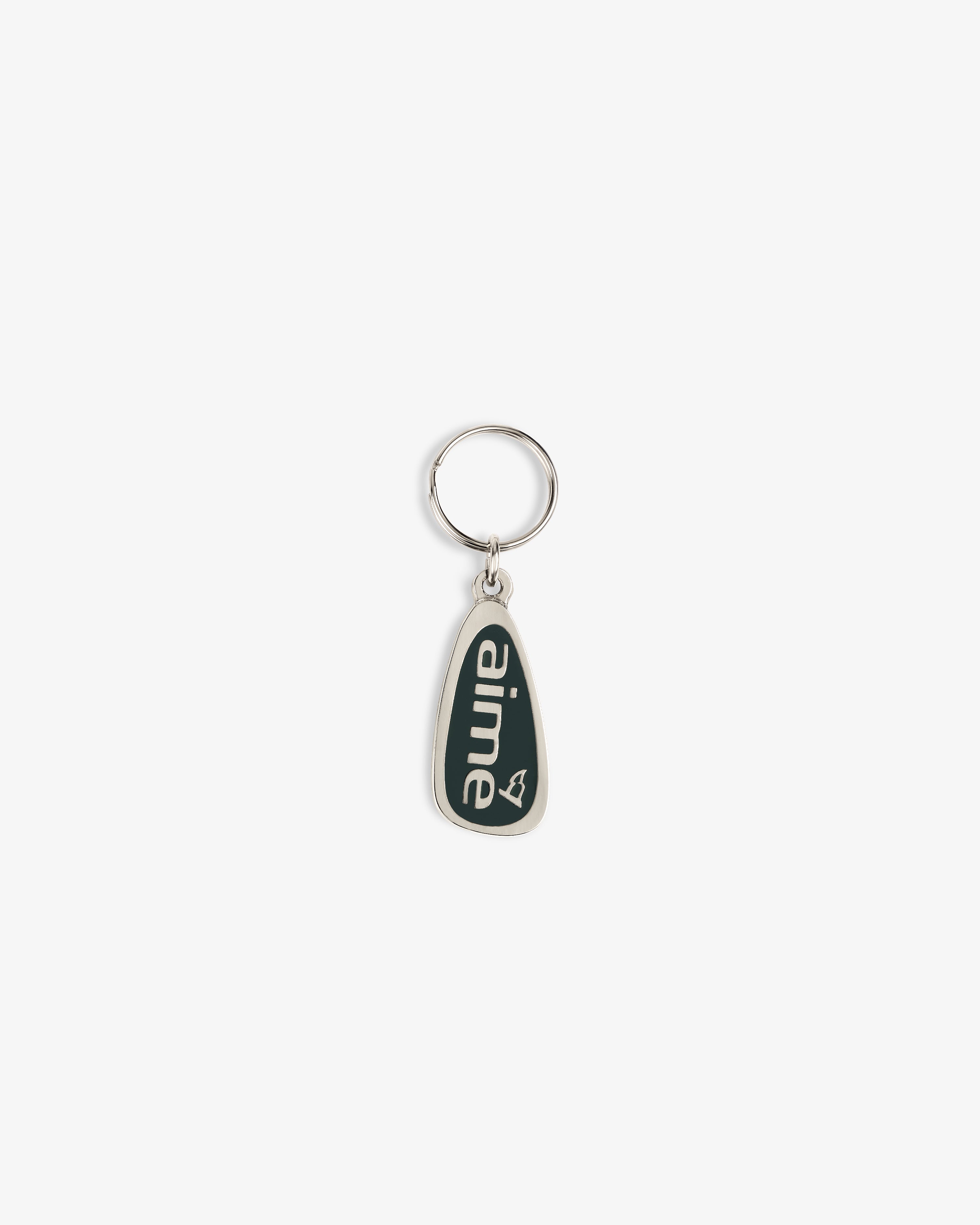 The ALD Golf Keychain is silver with a dark green tag reading "aime" in white lowercase letters and a heart outline.