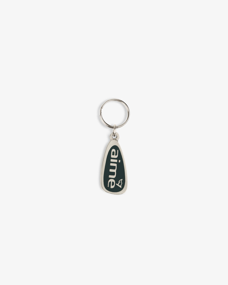 The ALD Golf Keychain is silver with a dark green tag reading "aime" in white lowercase letters and a heart outline.