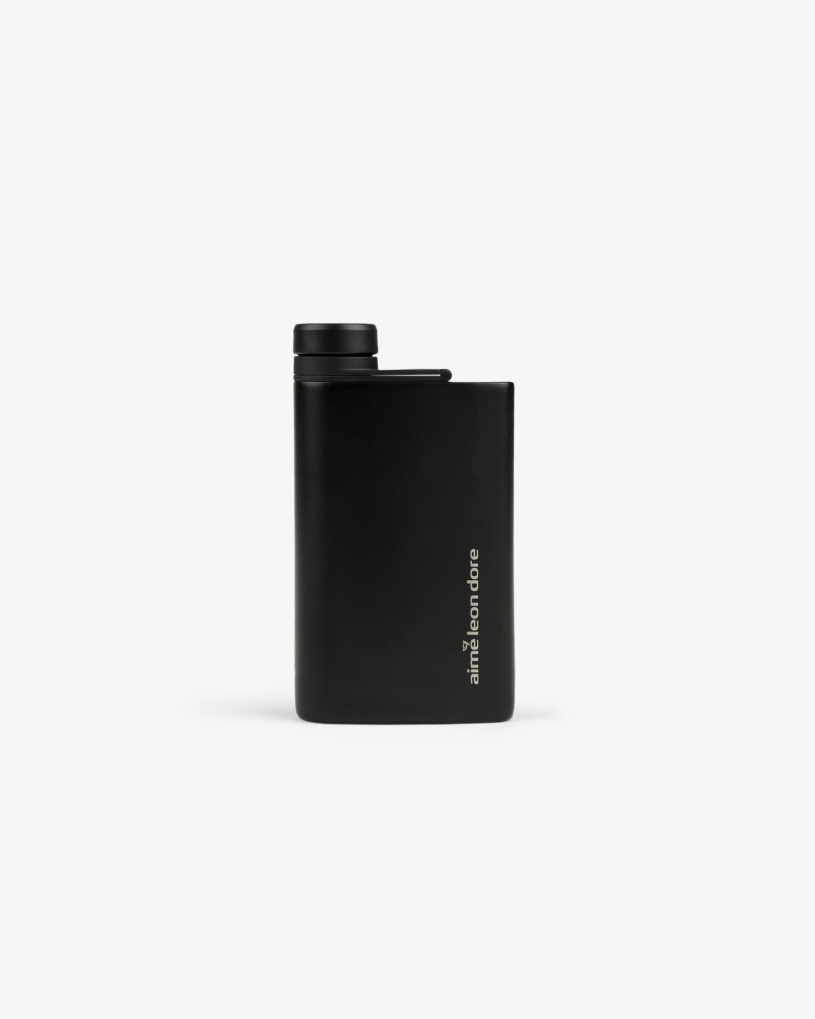ALD Golf 19th Flask: a slim black flask with a screw cap and "aimé leon dore" written vertically near the bottom.