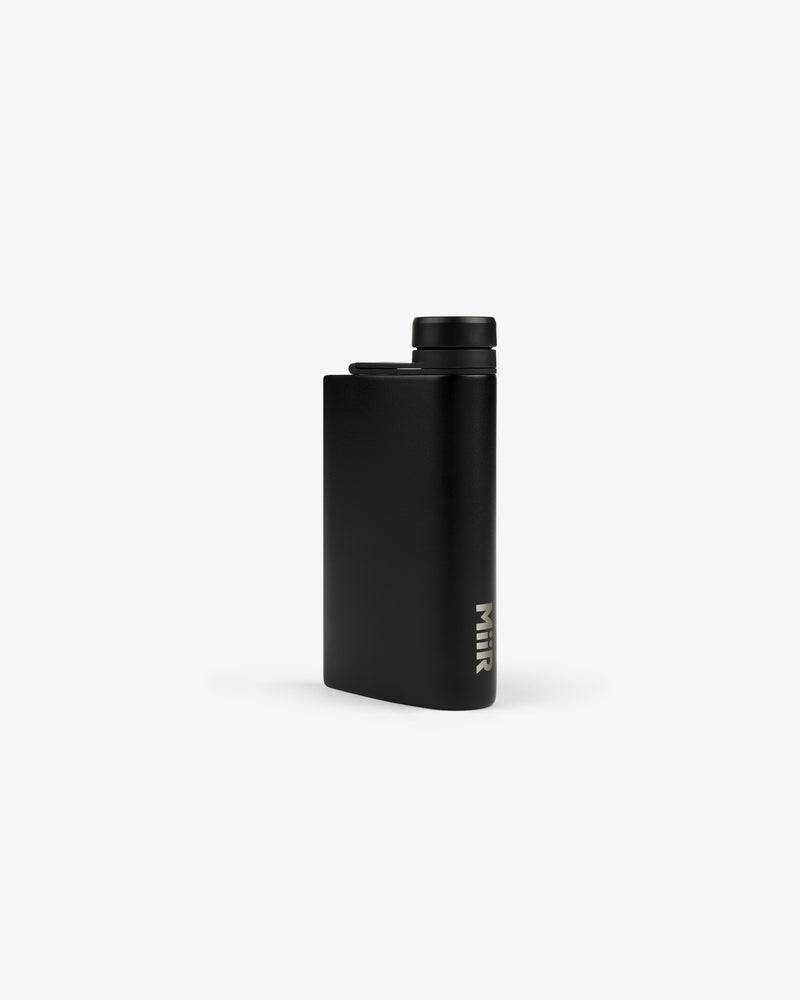 The ALD Golf 19th Flask is sleek and black with a screw-on cap and MiiR logo near the base, shown on white.