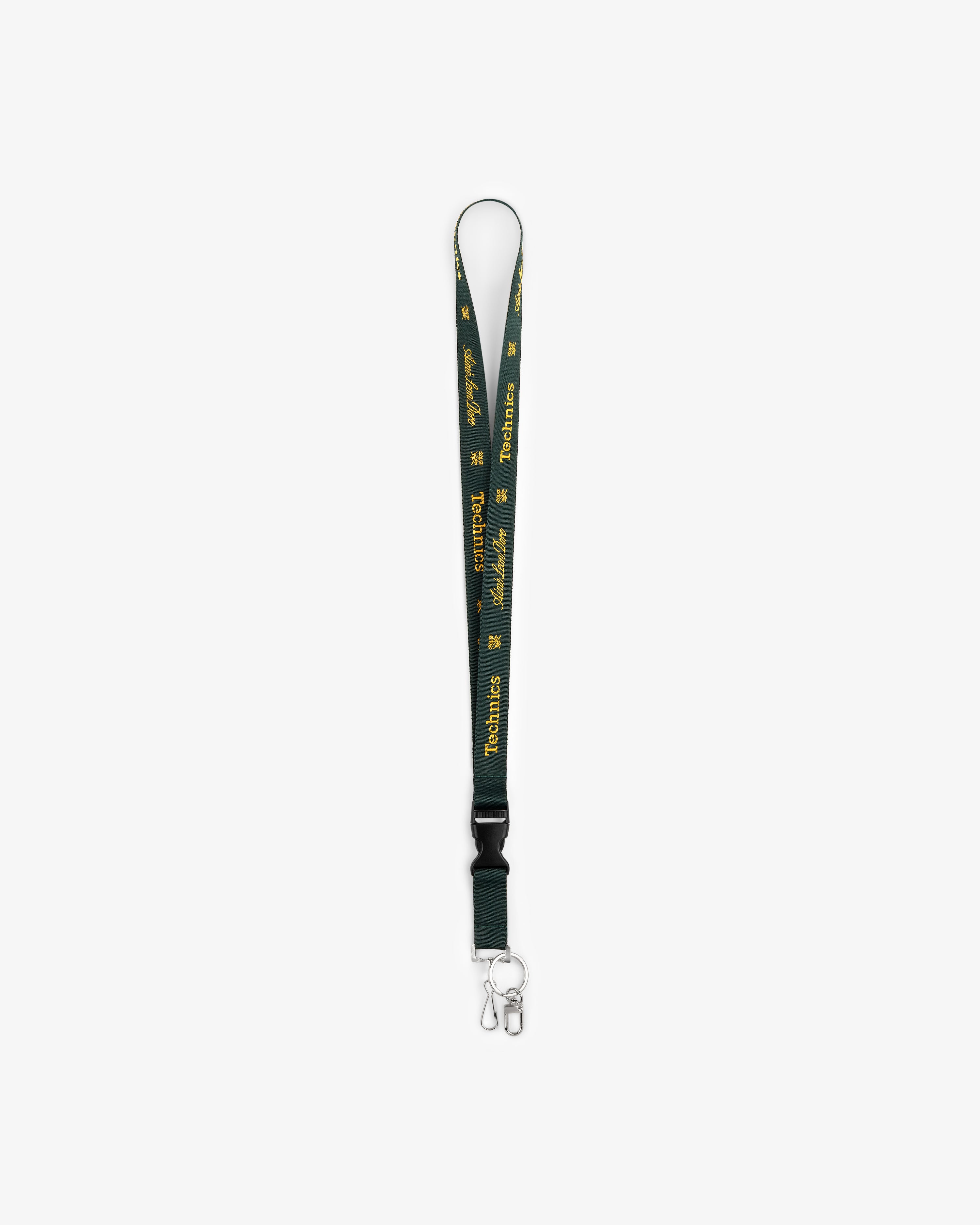 ALD / Technics Lanyard with green strap, yellow text, logo, metal clip, and keyring on a white background.
