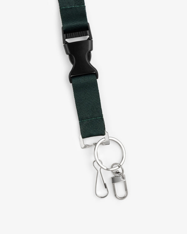 The ALD / Technics Lanyard is dark green with a black plastic buckle and silver key rings with clips attached.