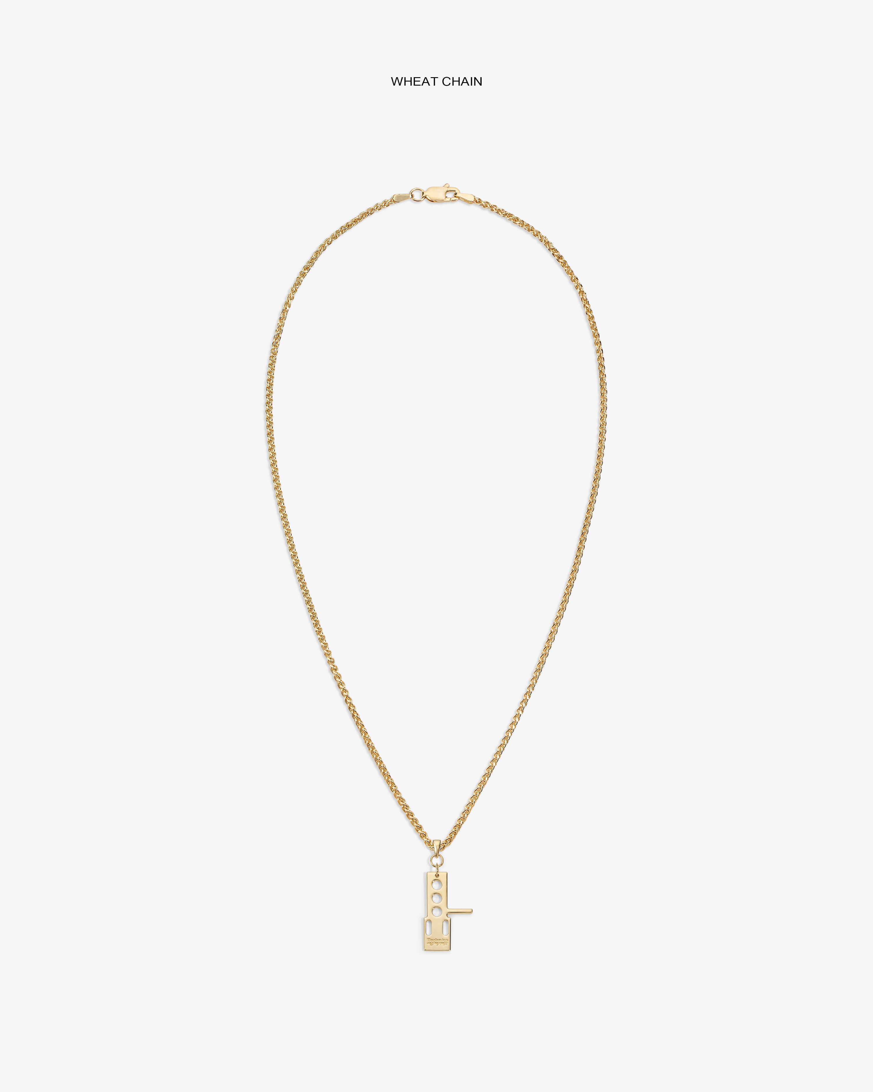 ALD / Technics 14Kt Gold Pendant: Rectangular key design on wheat chain, geometric cut-outs, white background.