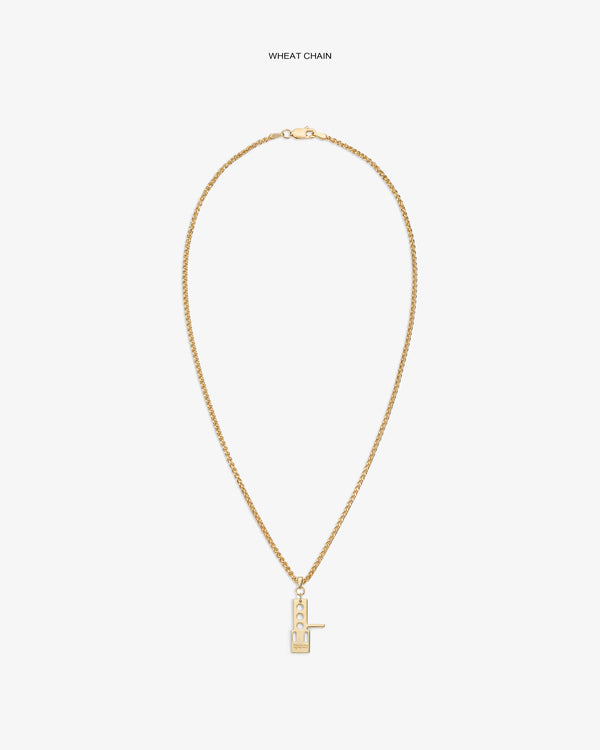 ALD / Technics 14Kt Gold Pendant: Rectangular key design on wheat chain, geometric cut-outs, white background.