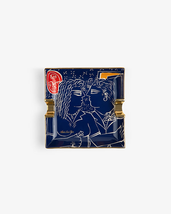 Fassianos "Nocturnal Love" ashtray: square ceramic with gold accents, red detail, and two figures facing each other.
