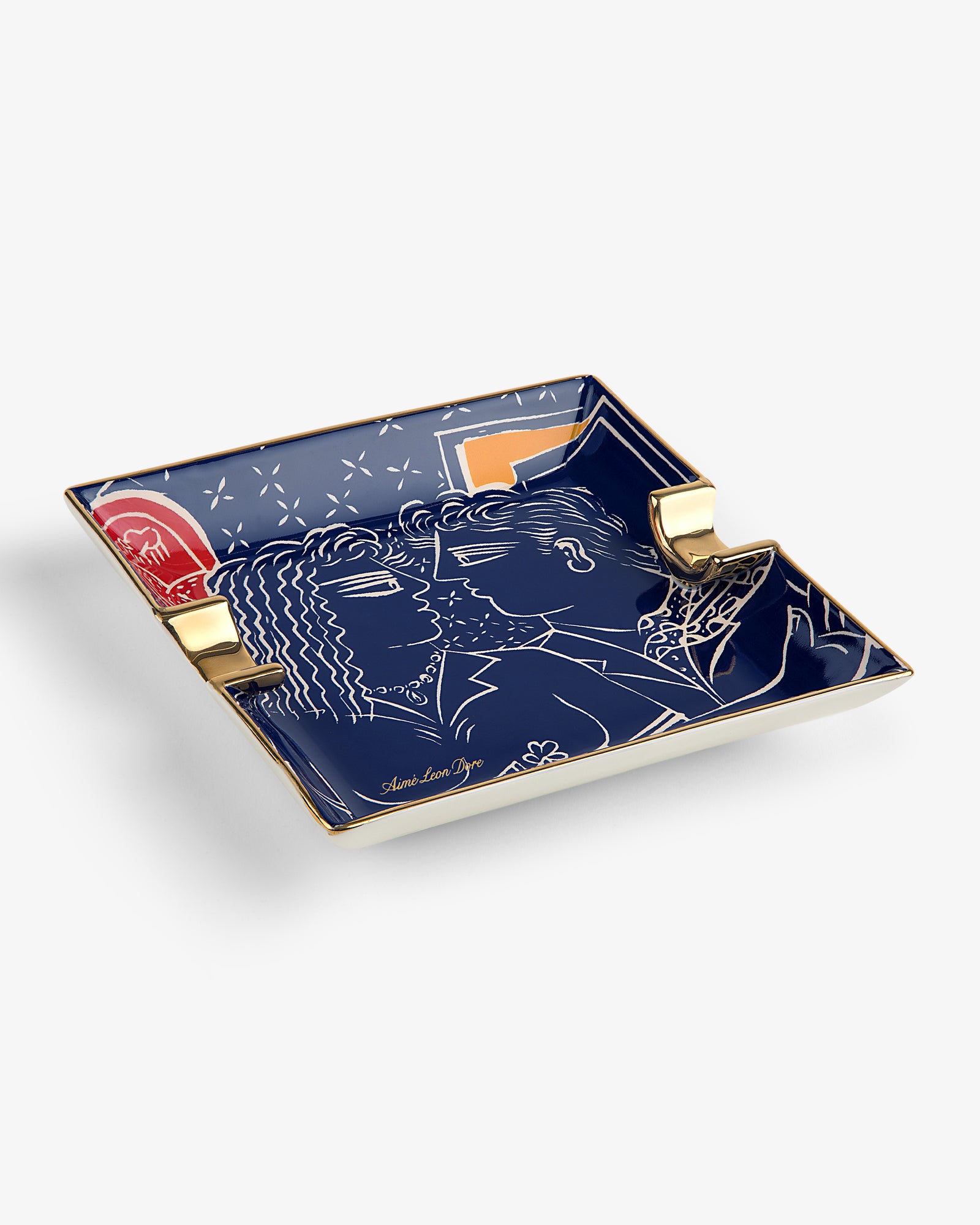 Fassianos "Nocturnal Love" blue porcelain ashtray with gold accents, showing two people facing each other.