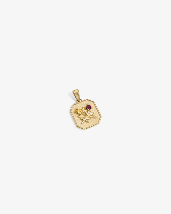 14Kt Gold Queens Crest Relief Pendant with a raised rose design and small red gemstone, shown on white background.