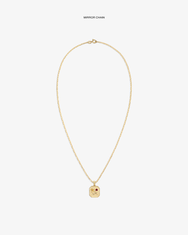 14Kt Gold Queens Crest Relief Pendant with small red gem, shown on a plain white background.