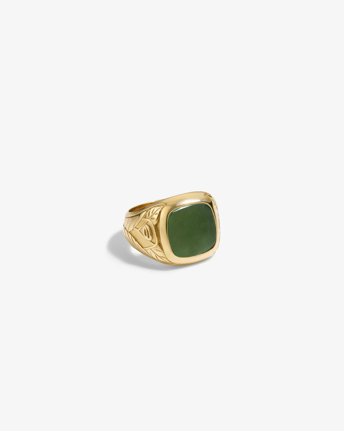 14Kt Gold Jade Signet Ring with an engraved leaf design and a rectangular green stone, on a white background.
