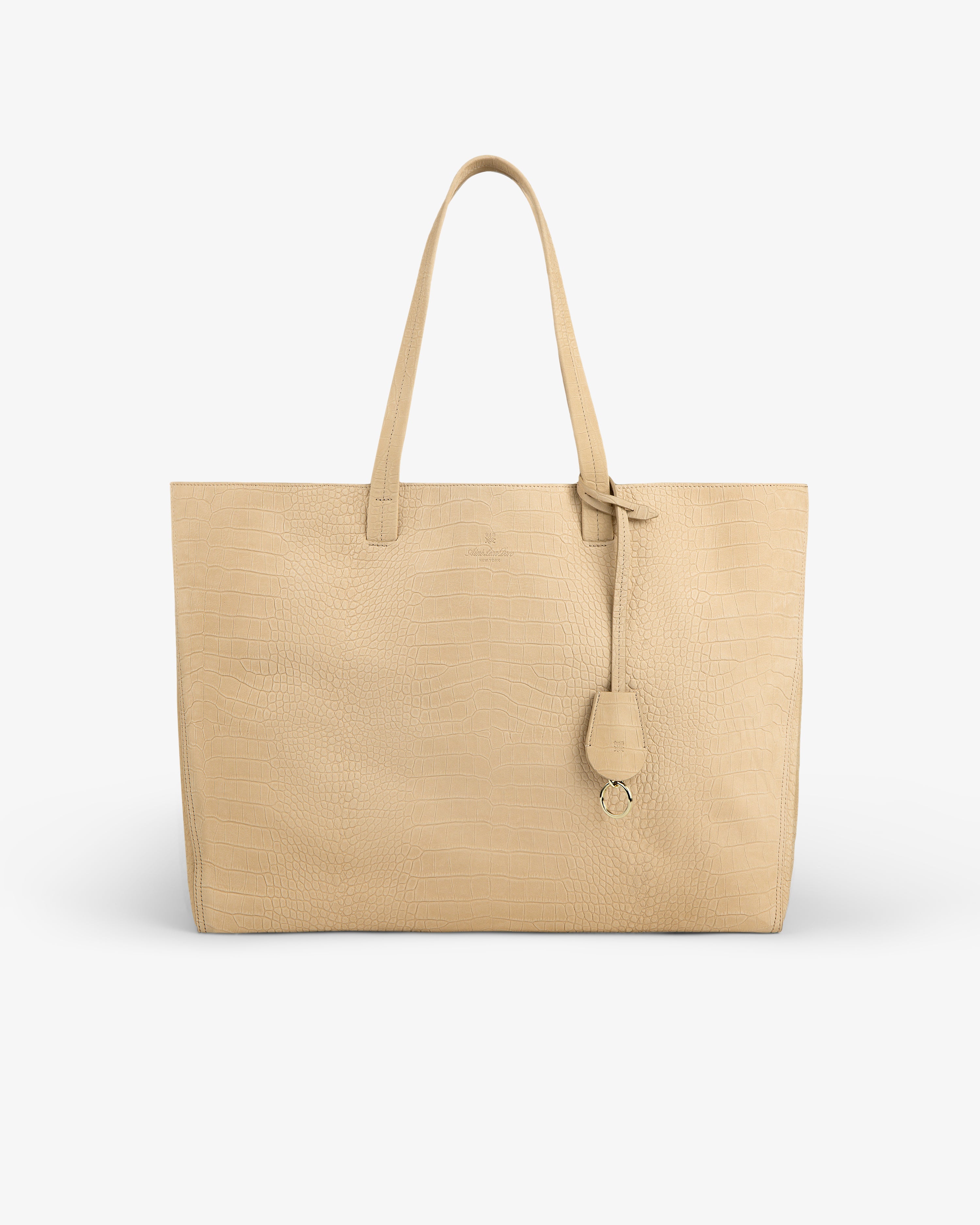 Croc-Embossed Nubuck Tote Bag with two handles and a tag, shown against a white background.