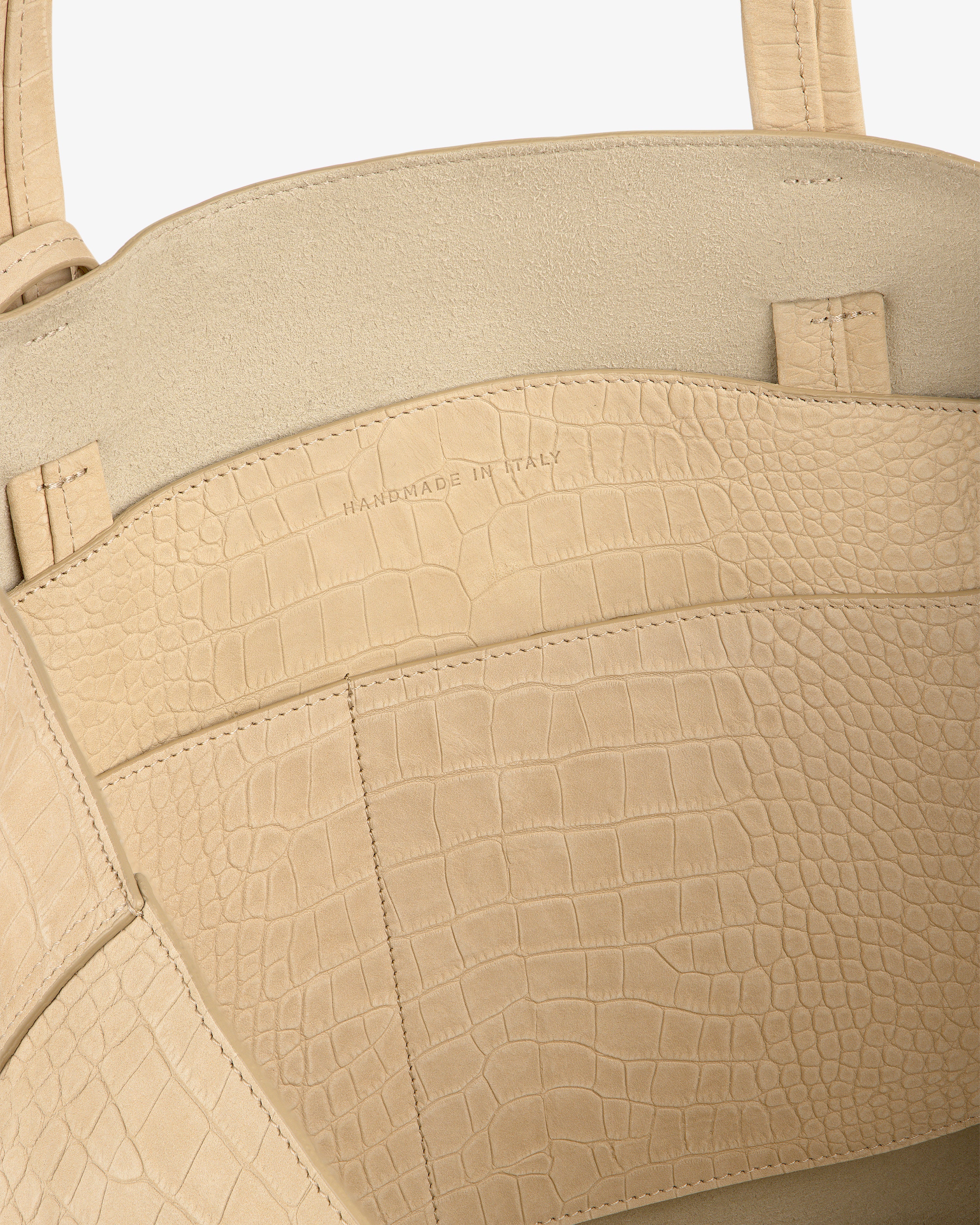 Close-up of Croc-Embossed Nubuck Tote Bag interior with HANDMADE IN ITALY stamped on the pocket.