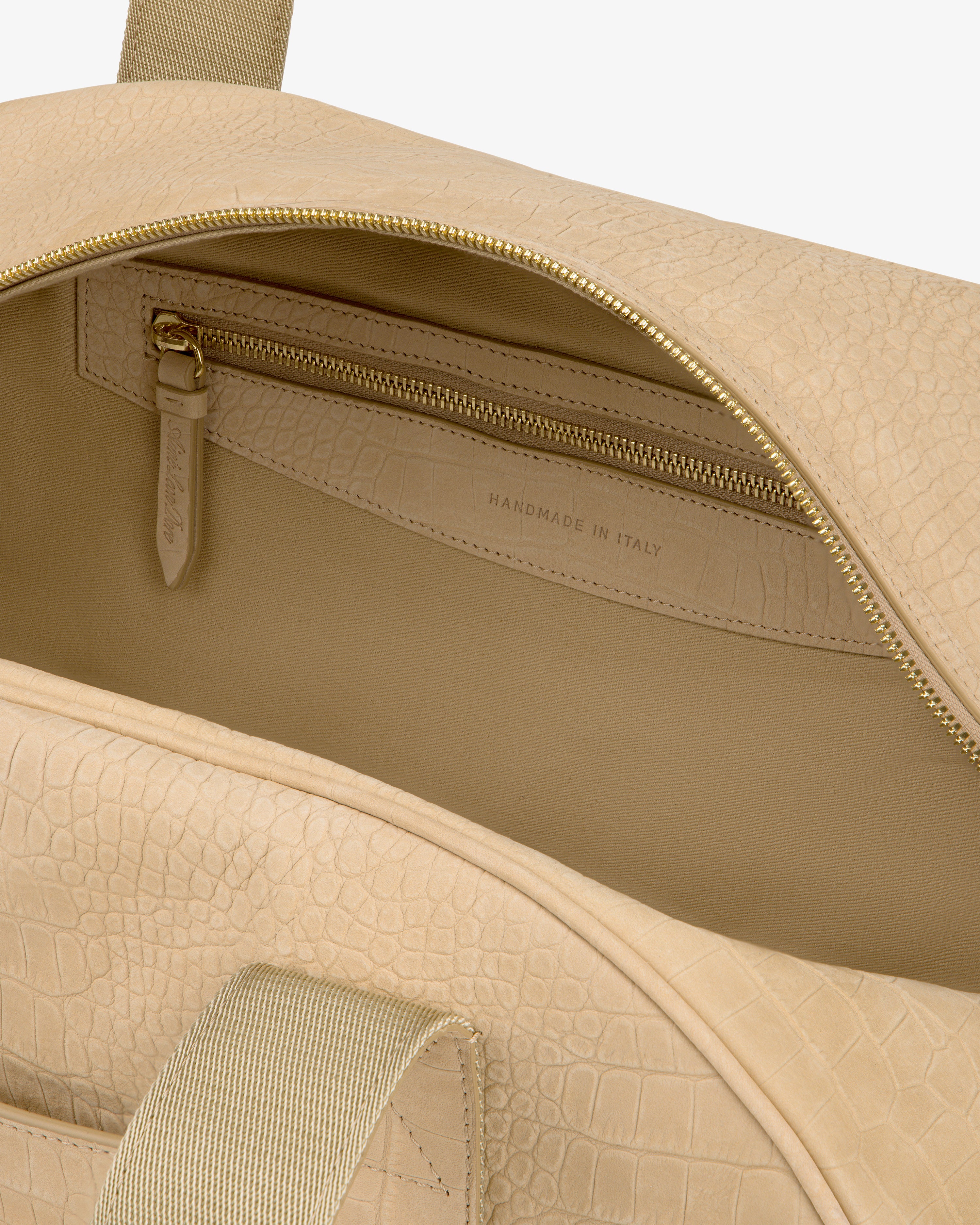 Open Croc-Embossed Nubuck Duffle in beige leather, featuring an inner zip pocket and “Handmade in Italy” lining.