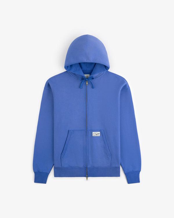 Sun Faded Full-Zip Hoodie in bright blue with front pocket, drawstring hood, and a small white front label.