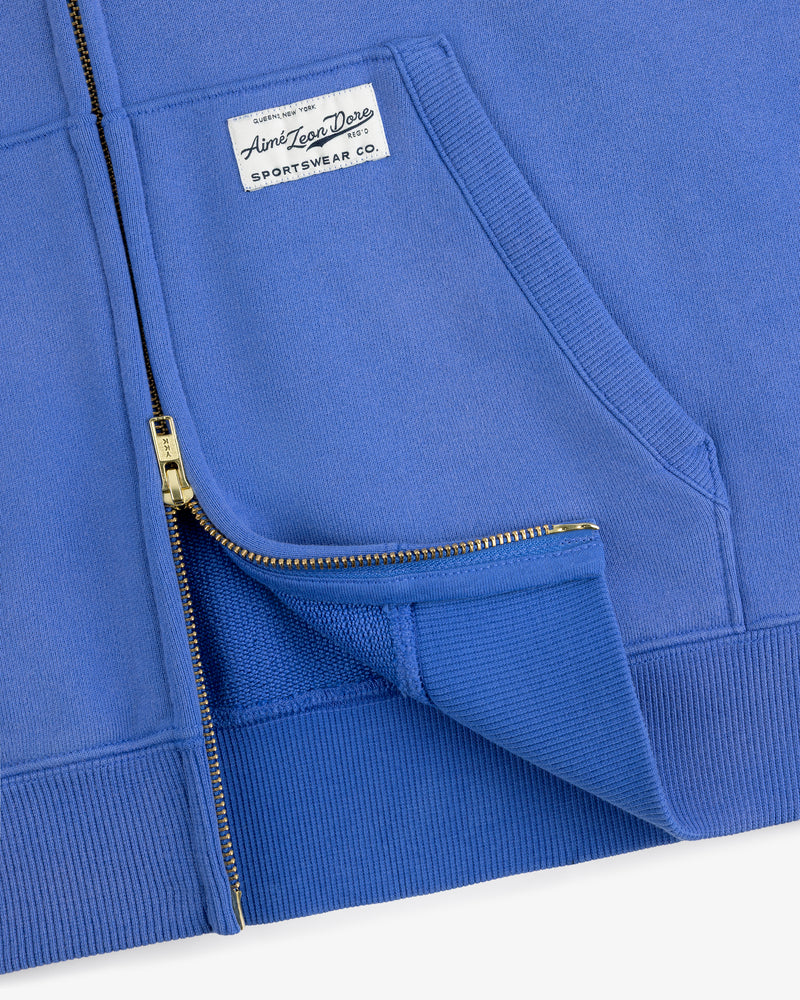 Close-up of the Sun Faded Full-Zip Hoodie highlighting its zipper, pocket, and chest sportswear label.
