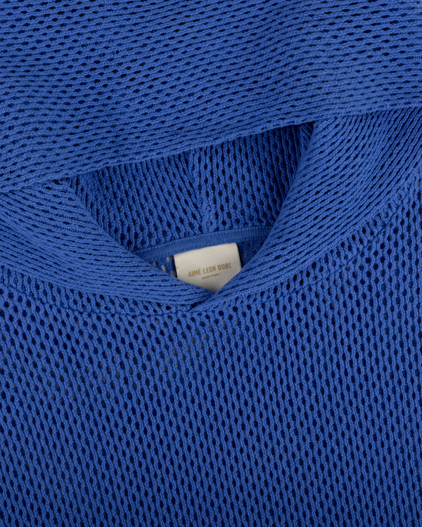 Close-up of an Open Mesh Hoodie in blue with a visible white clothing label inside the neckline.