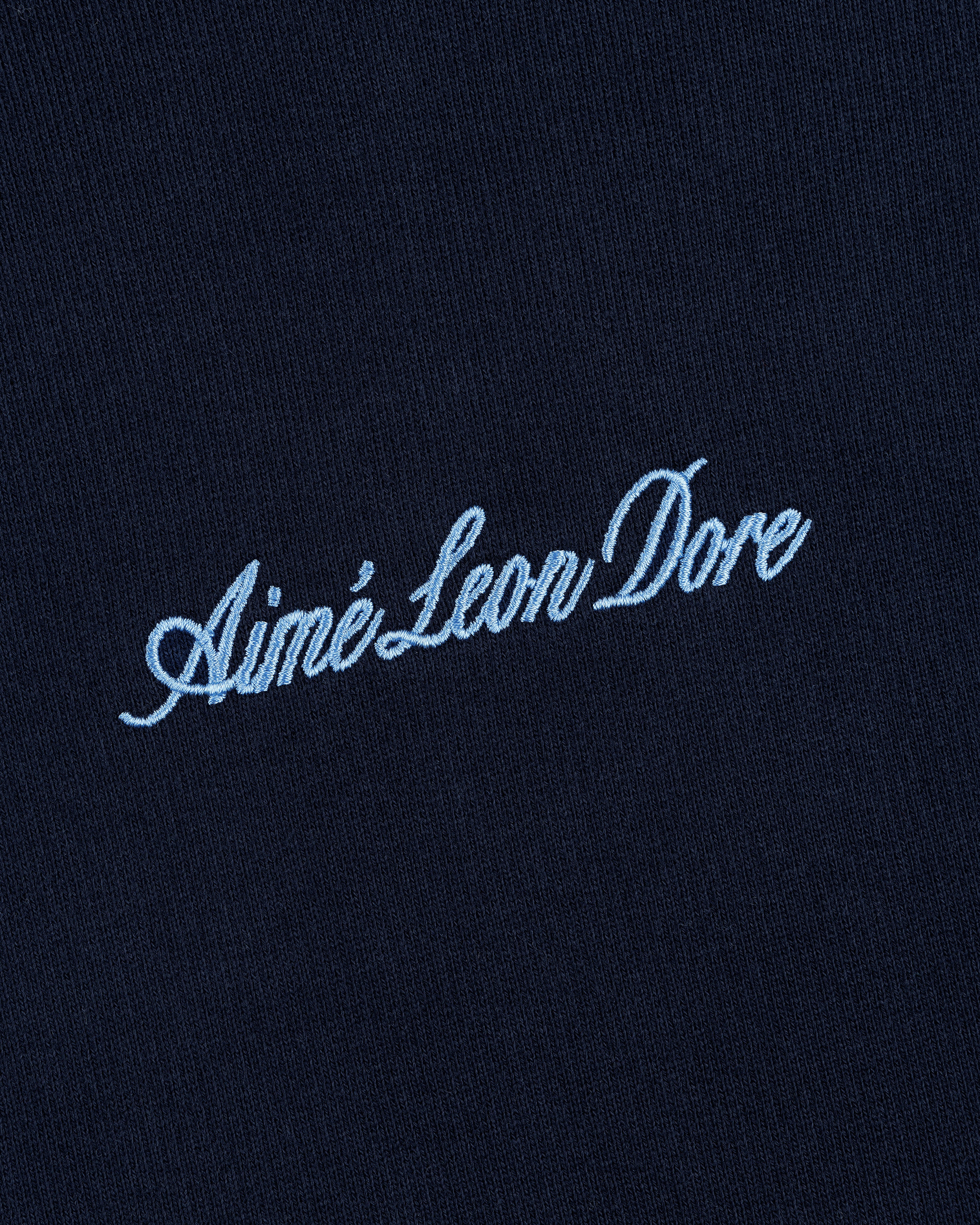 Navy blue Embroidered Logo Hoodie with Aimé Leon Dore in light blue cursive embroidery.