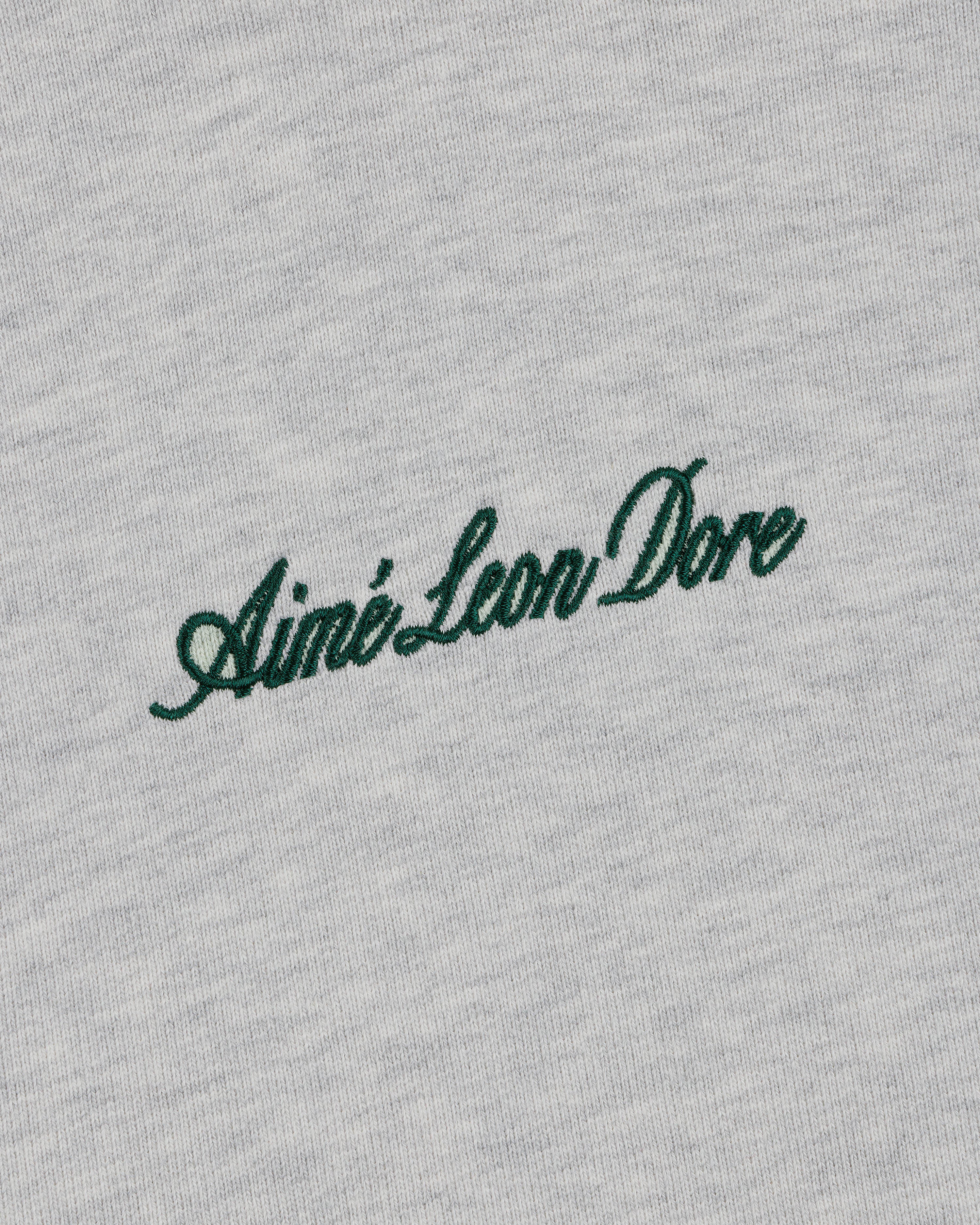 Green script "Aimé Leon Dore" embroidered on light grey Embroidered Logo Hoodie.
