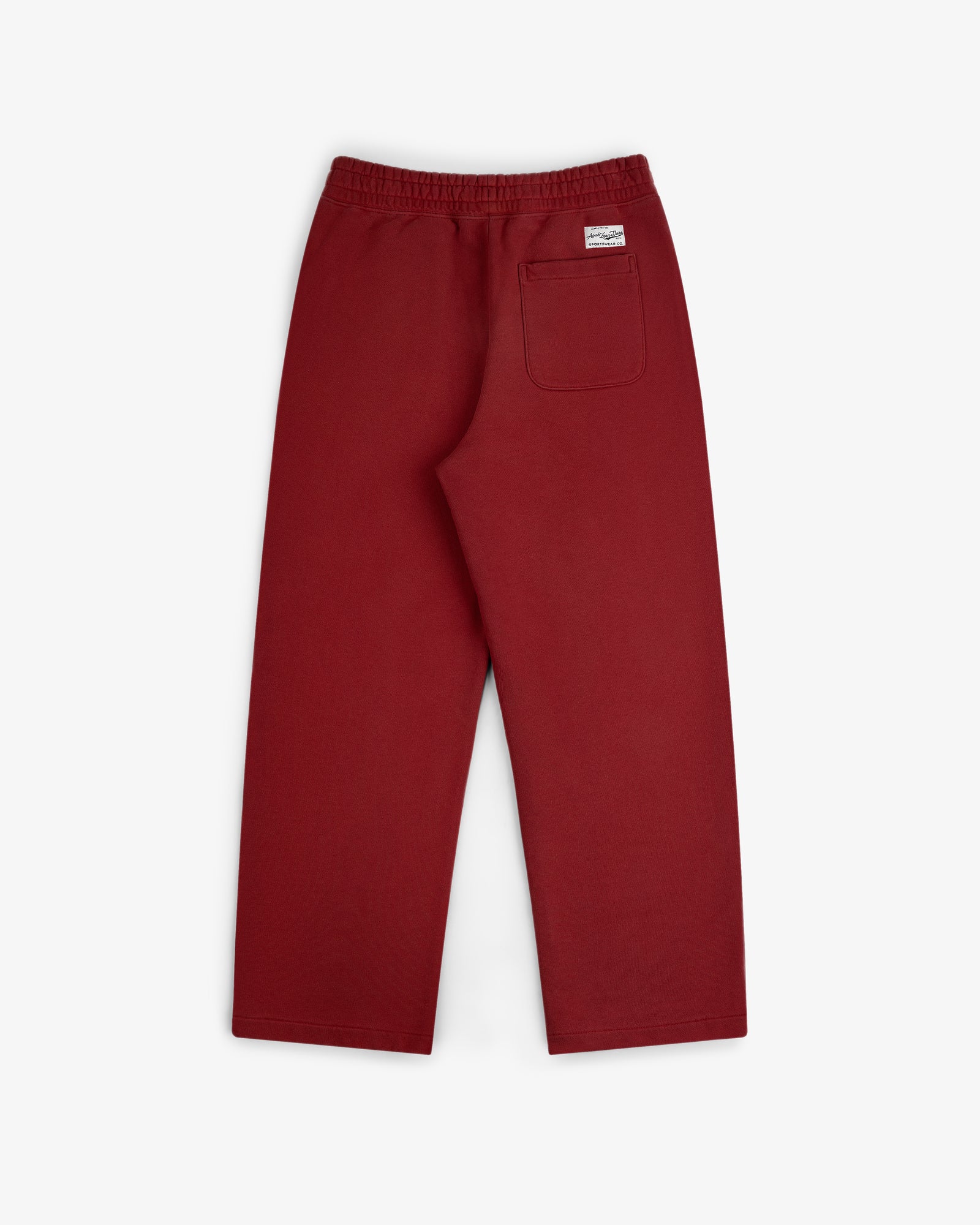 Back view of Sun Faded Sweatpants in red, featuring an elastic waistband and a right-side patch pocket.
