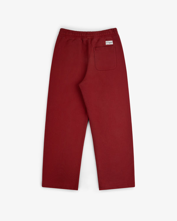 Back view of Sun Faded Sweatpants in red, featuring an elastic waistband and a right-side patch pocket.