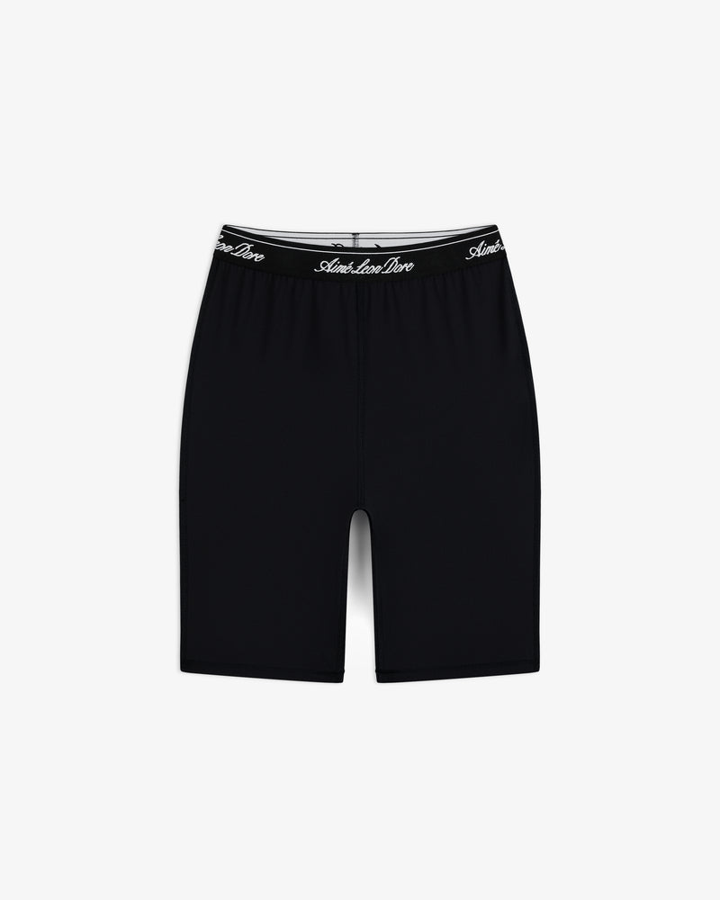 Logo Biker Short: Black, knee-length fitted shorts with a black elastic waistband and white script text.