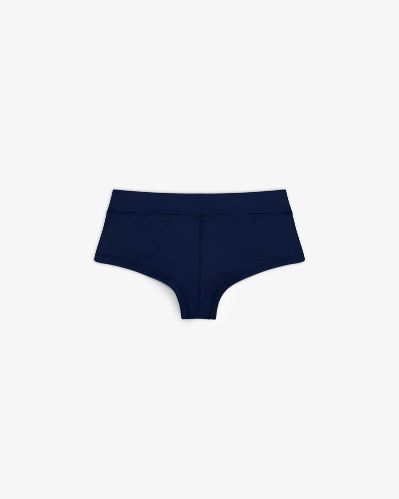Navy blue Crest Swim Short high-waisted women's underwear laid flat on a white background.