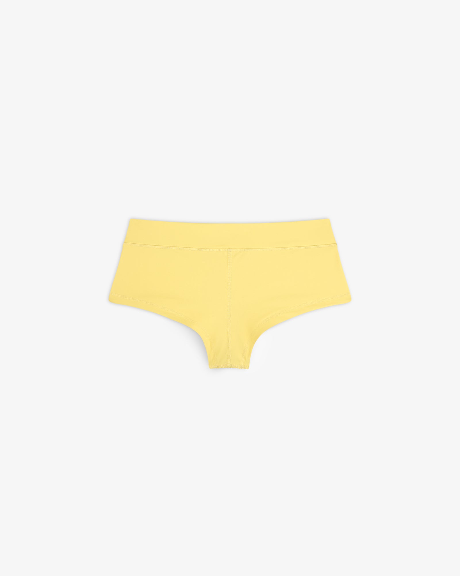 Crest Swim Short in yellow, seamless boyshort style, displayed flat on a white background.